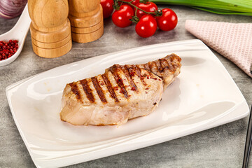 Grilled pork loin steak with bone