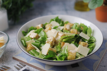 A bowl with classic Caesar salad