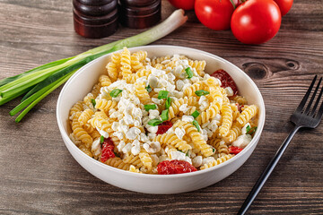 Italian pasta fusili with curd