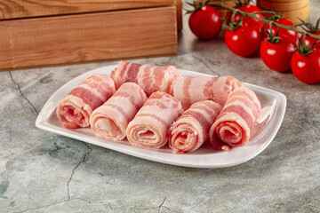 Raw bacon pork roll sliced