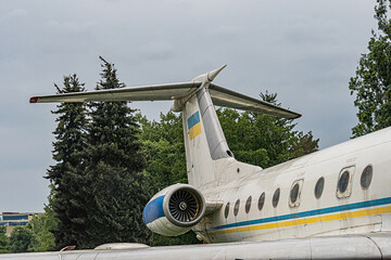 Close-up image of a blue and yellow passenger jet engine in motion, visible part of the plane with...