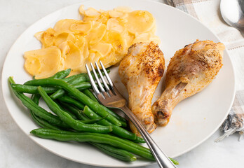 chicken drumsticks  with scallop potatoes