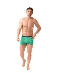 Fototapeta premium Young man in stylish turquoise underwear on white background