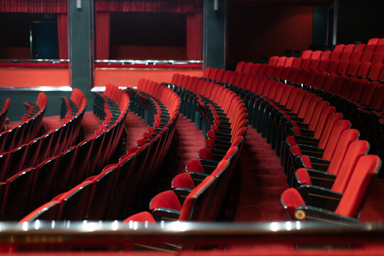 Empty theater with red seats before the evening performance