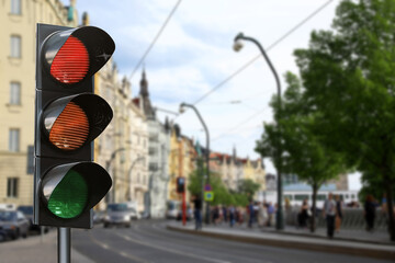 Traffic lights on city street. Signaling device