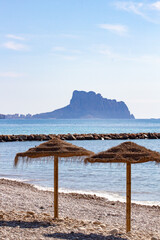 View from La Roda beach in Altea to turquoise Mediterranean sea and Rock of Ifach. Altea town, Alicante province, Spain