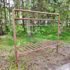 Metal carpet hanger, used in Finland and Sweden for beating and dusting carpets outside of living spaces