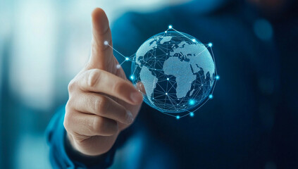Hand on digital globe. A hand is reaching out to interact with a floating digital globe, illustrating global connectivity and technology.