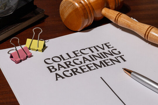 Union-Employer Contract Document on Desk – Legal Framework of Collective Bargaining Process