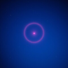 Fototapeta premium Halo de lumière rouge sur un fond bleu qui comporte des petites étoiles