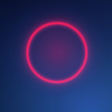 Halo de lumi&egrave;re rouge sur un fond bleu qui comporte des petites &eacute;toiles