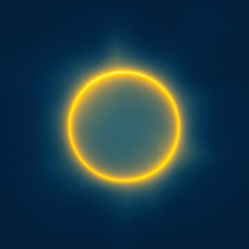 Halo de lumi&egrave;re jaune sur un fond bleu qui comporte des petites &eacute;toiles