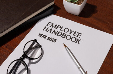Workplace Policy Handbook Displayed with Pen and Glasses – Employment Law and HR Reference