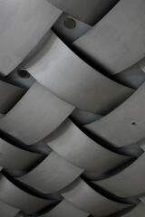 The concrete ceiling has a structure that resembles the bamboo woven square pattern