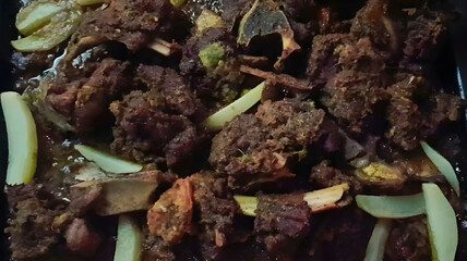 A tray of perfectly fried and spiced mutton chops, cooked to golden brown and served with onion slices. A flavorful and aromatic Indian non-vegetarian dish ideal for festive or special meals.