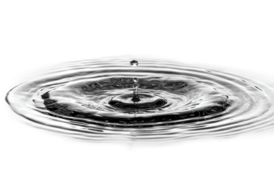 Close-up of water droplets creating ripples on a smooth surface, cut out