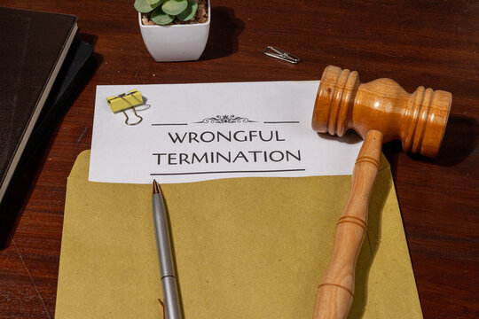 Document Detailing Wrongful Termination on Table &ndash; Representation of Employee Rights Violation