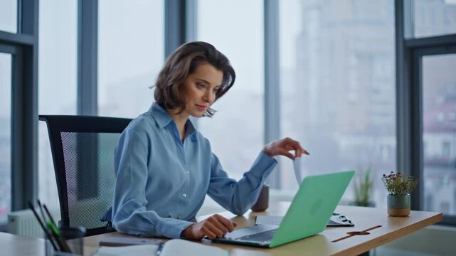 Financial manager reviewing papers at office closeup. Successful businesswoman