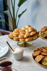 Traditional Arabic and Turkish sweets with sesame, pistachios and dates for Eid al-Adha and Ramadan
