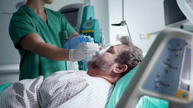 Doctor providing oxygen ventilation to unconscious patient in hospital.