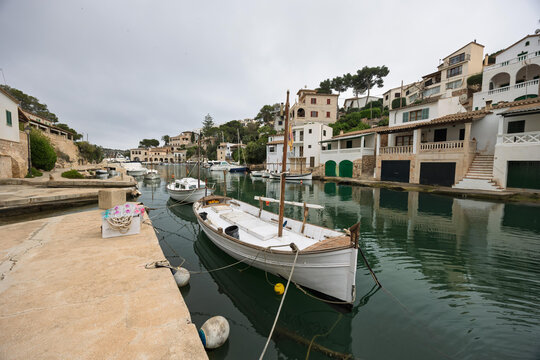 Traditional llaut boat moored in the picturesque port of cala figuera, majorca, spain