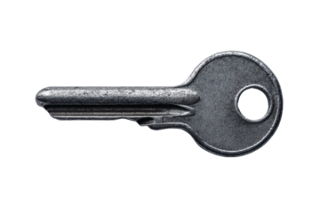 Close-up of silver metallic key on black background for security concept, cut out