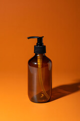 Amber bottle with pump dispenser for soap, lotion, or other liquids