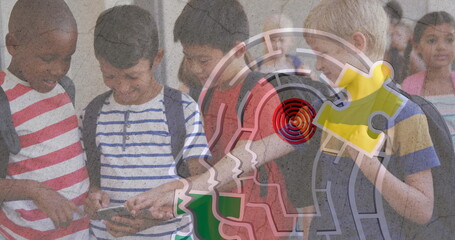 Jigsaw puzzle and human head icon against diverse group of boys using smartphone at school