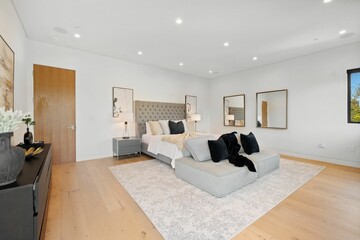 Modern luxury home exterior at sunset with pool, outdoor lounge, and contemporary architecture