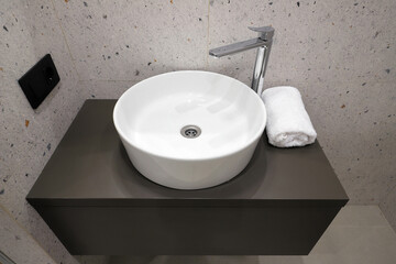 Faucet with ceramic sink in the bathroom