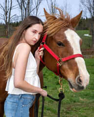 a young woman with her horse