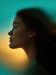 Fototapeta premium Close-up portrait of a young woman's face. she is facing away from the camera, with her head tilted slightly to the side. her hair is long and flowing, cascading down her back.