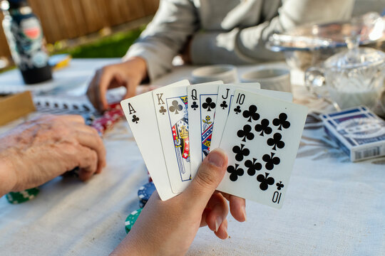 Playing Poker on the table with Chips 
