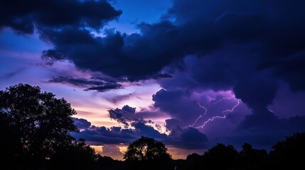 Naklejka premium Dramatic sunset sky with dark clouds and lightning in the distance, a captivating nature scene for weather and mood enthusiasts.