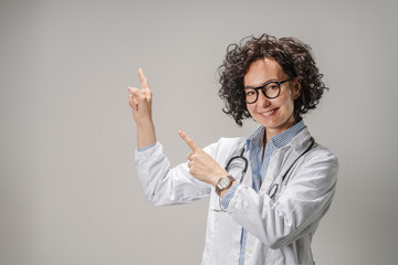 Studio shot of female doctor, laugh show backgrounds with fingers