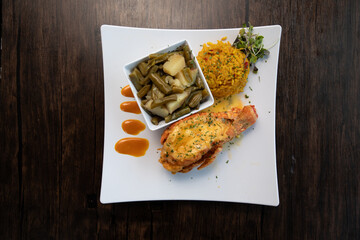Fried Lobster Tail with Yellow Rice on White Plate