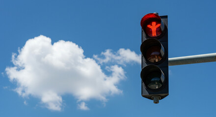 A pedestrian traffic light showing a red figure with a cloud and a blue sky in the background
