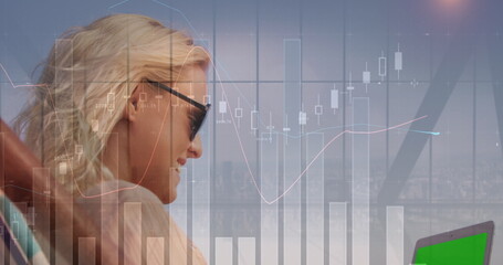 Image of statistical data processing over caucasian woman using laptop with copy space