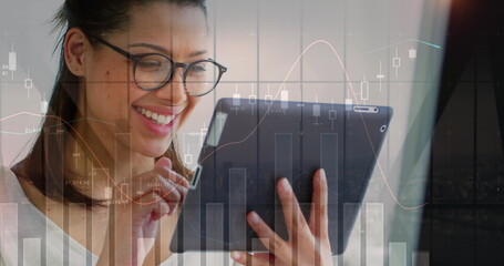 Image of statistical data processing over woman using digital tablet