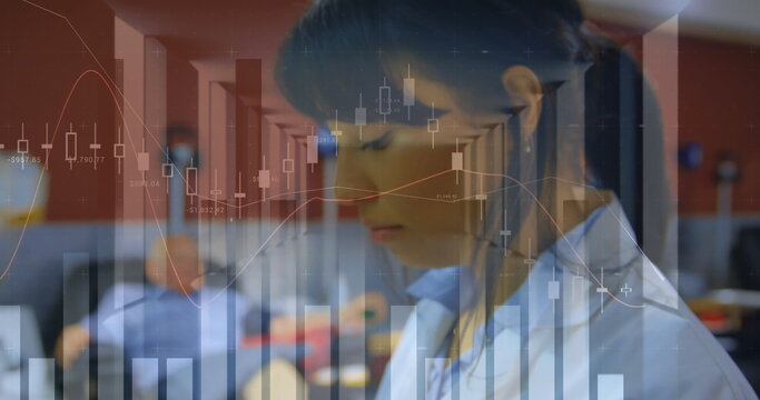 Image of statistical data processing over woman using digital tablet