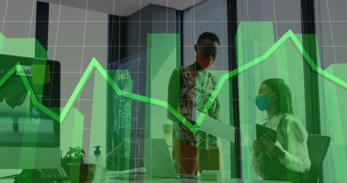 Image of financial data processing over diverse business people wearing face masks