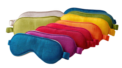 Sleep masks in rainbow colors are arranged in a diagonal line, creating a vibrant display against a transparent background, ideal for promoting restful sleep and relaxation