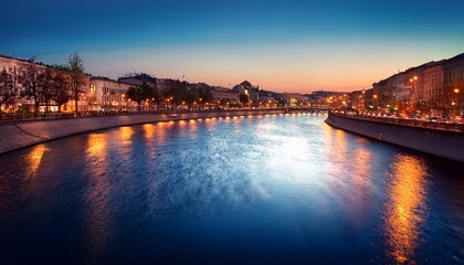Obraz premium a bend in the river against the backdrop of the evening city evening street lights vintage blur effect