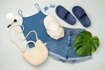 Flat lay with casual summer outfit on color background, top view