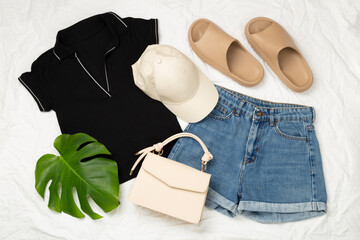 Flat lay with casual summer outfit on color background, top view