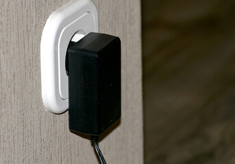 The charger is plugged into the outlet.