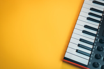 Musician concept. Black and White Piano Keys on a Bright Yellow Background in a Minimalist Style Design © JK_kyoto