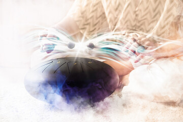 Woman playing glucophone and meditating at home, closeup