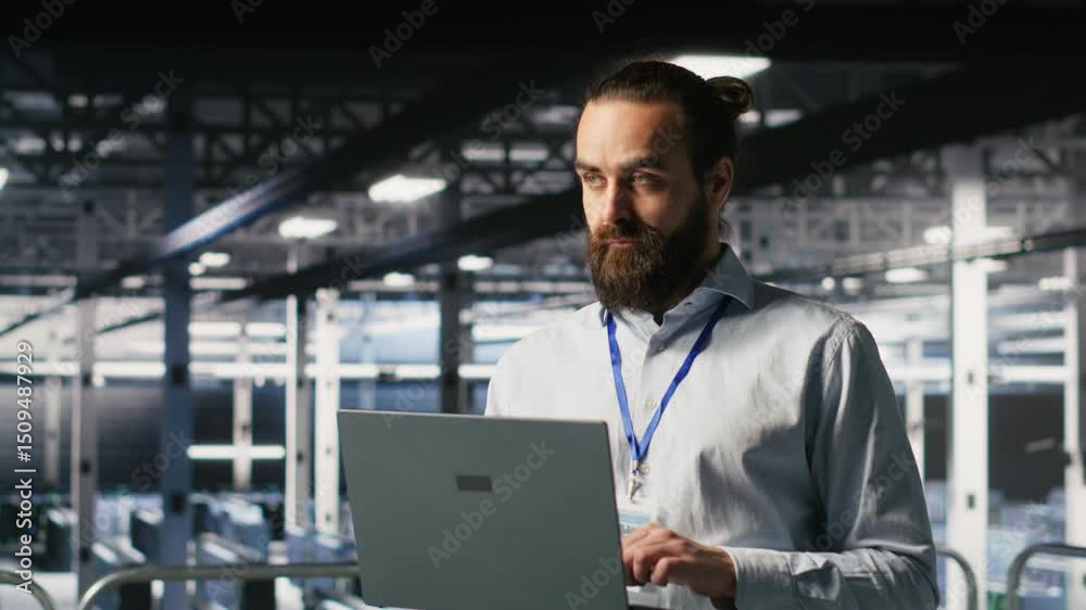 Poster computer scientists on data center industrial platform analyzing performance outputs on laptop. serv