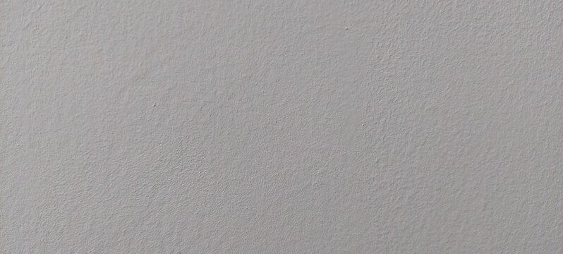 Imagen de una superficie gris con un patr&oacute;n sutil de textura rugosa, ideal como fondo neutro o recurso visual para proyectos gr&aacute;ficos. La textura ofrece un acabado mate y uniforme con relieve fino, pe